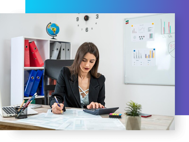 Woman calculating at desk