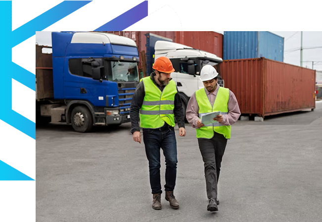 Workers inspecting trucks