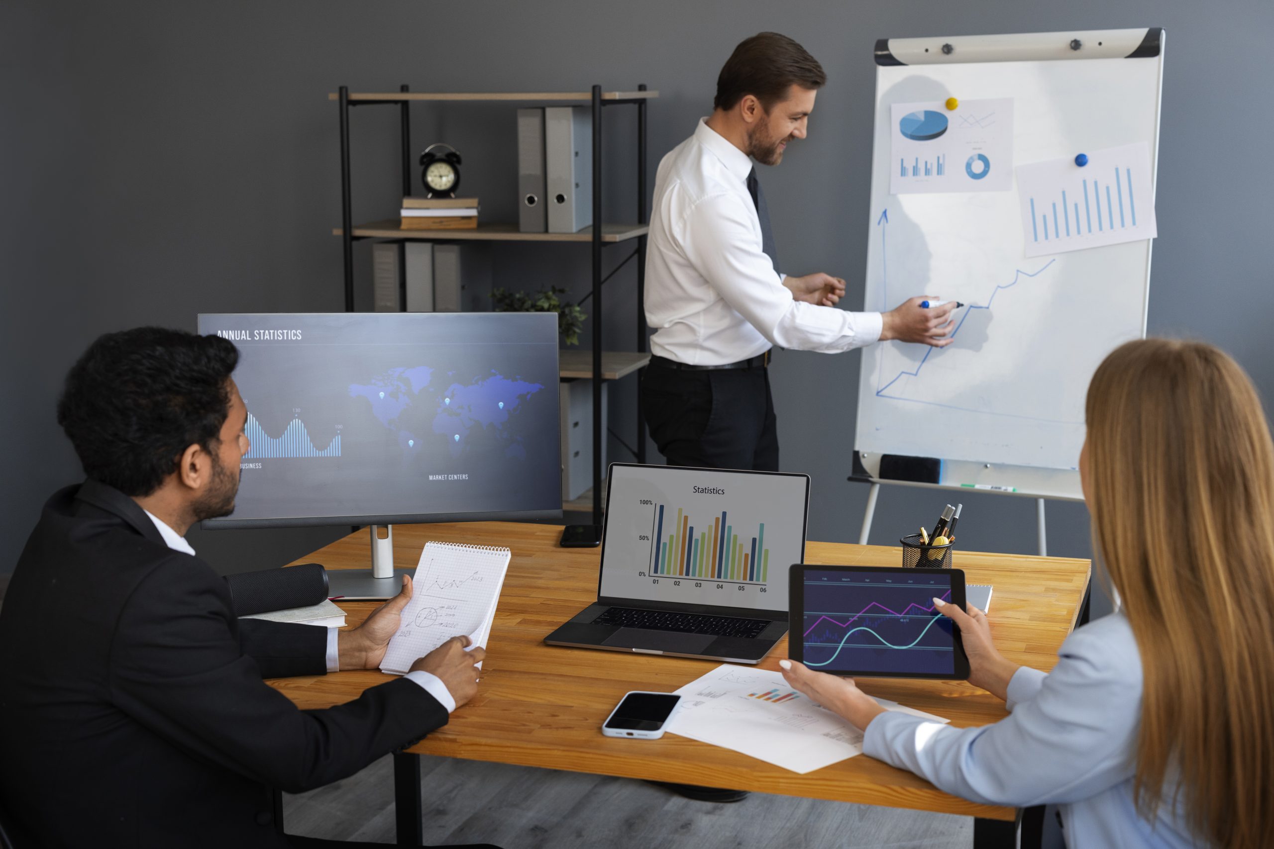 business person looking finance graphs scaled