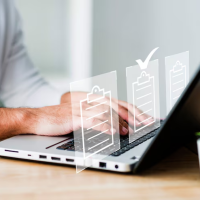 Man on laptop, checklist