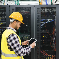 Engineer inspecting server racks