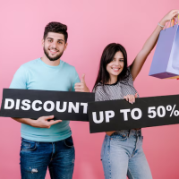 Couple with discount signs